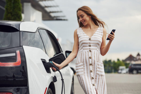 The woman charging an electric car