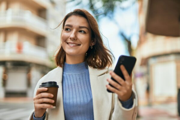 The woman holding her phone